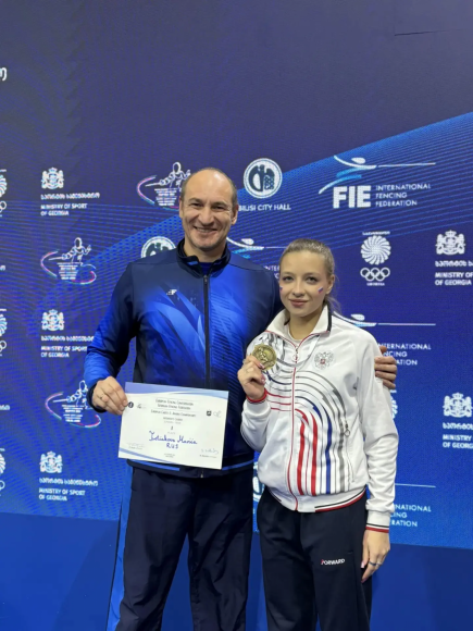 Победительница первенства Европы Мария Третьякова с тренером Валерианом Феоктистовым 